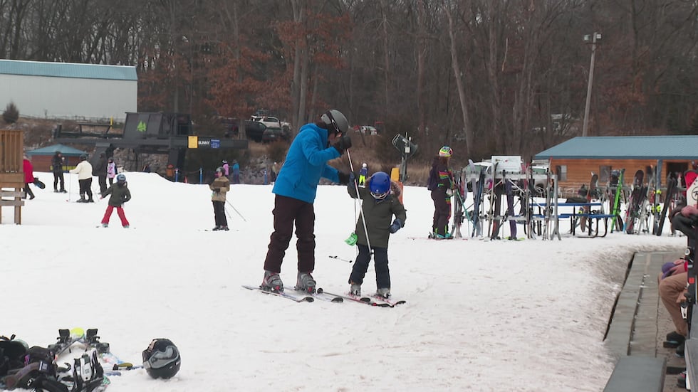 Skiers and snowboarders enjoy Cascade Mountain despite warming temps