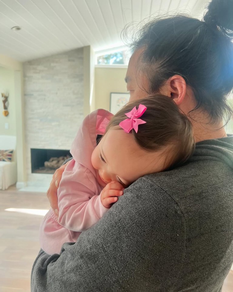 Person holding a baby.