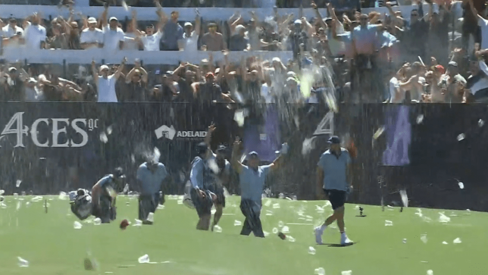 Reed was showered with beer and cups after his hole-in-one