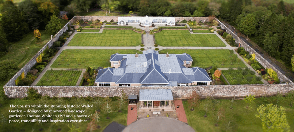 Aerial view of spa within a walled garden.