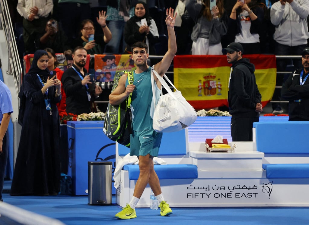 Carlos Alcaraz waves to the crowd after losing his quarter final match against Jiri Lehecka. Photo: Reuters
