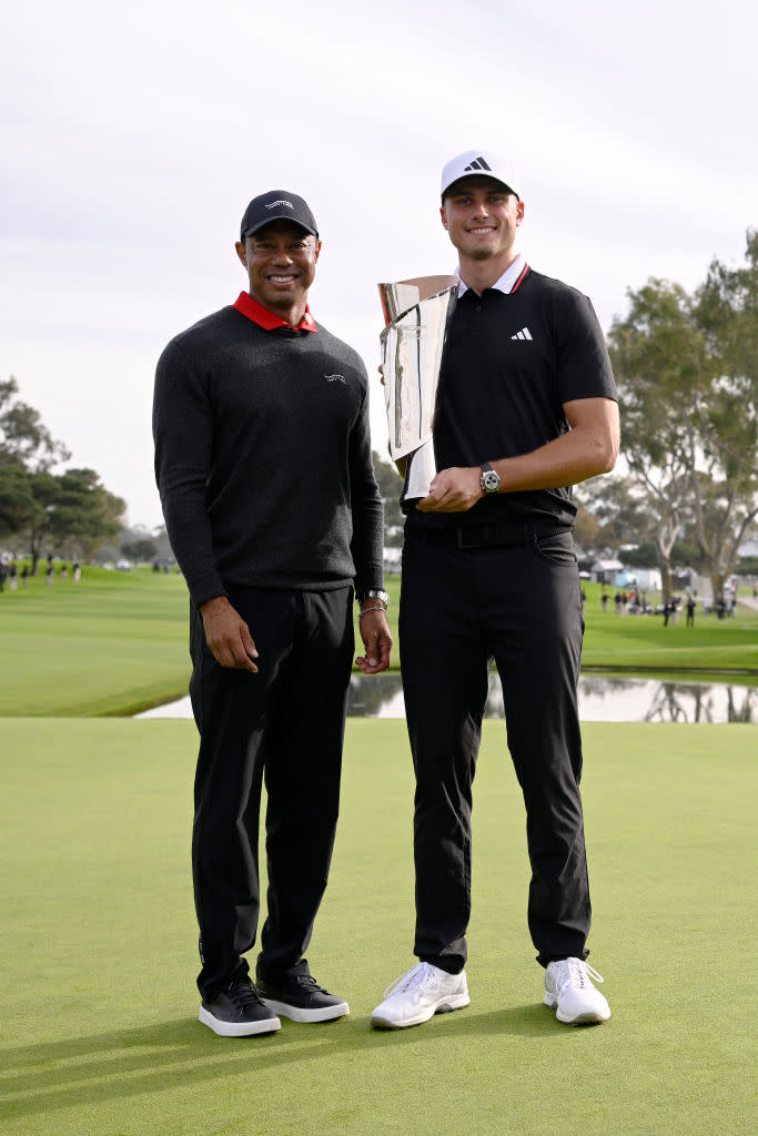 LA JOLLA, CALIFORNIA - FEBRUARY 16: Tiger Woods (L) and Ludvig Åberg of Sweden pose for photos with the trophy after Åberg won The Genesis Invitational 2025 at Torrey Pines Golf Course on February 16, 2025 in La Jolla, California. (Photo by Orlando Ramirez/Getty Images)