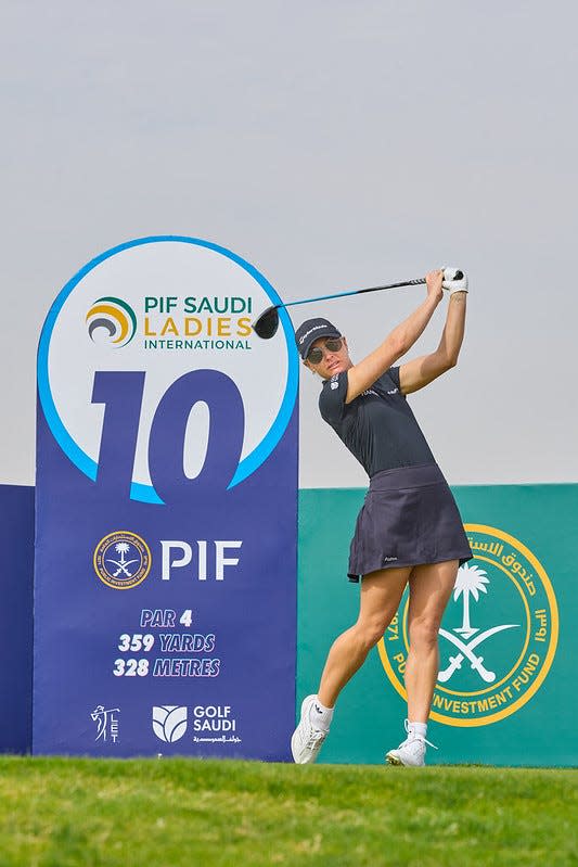 Charley Hull tees off at the 2025 PIF Saudi Ladies International at Riyadh Golf Club.