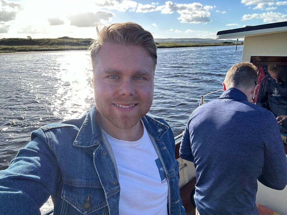 Man taking a selfie on a boat in Northern Ireland.