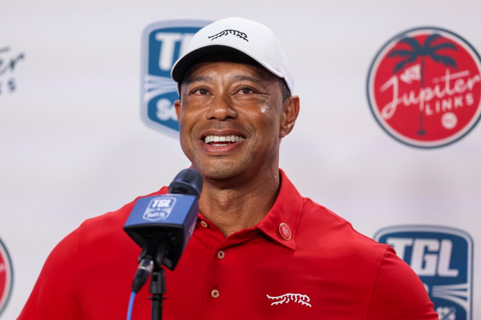 Tiger Woods being interviewed at a golf event.