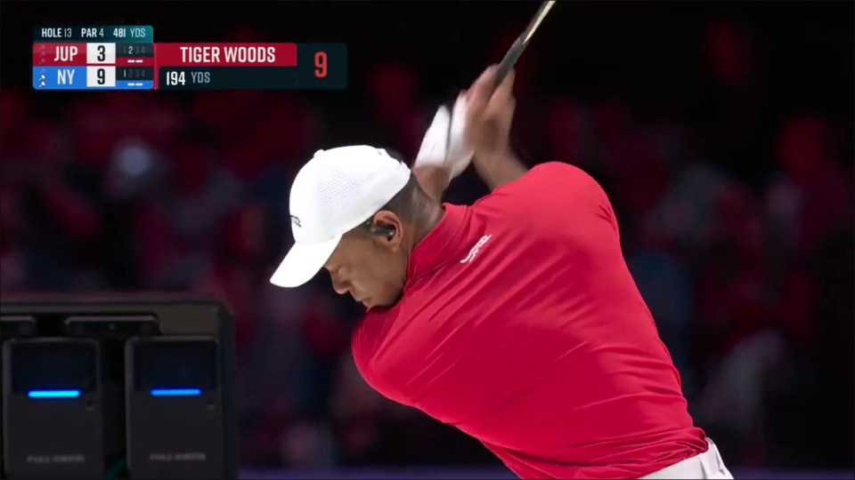 Tiger Woods golfing.