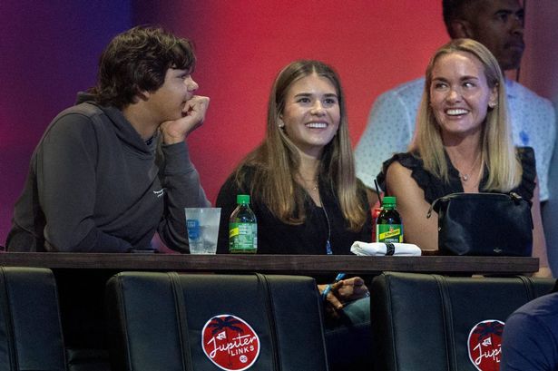 Charlie Woods talks to Kai Trump, center, and her mom Vanessa Trump