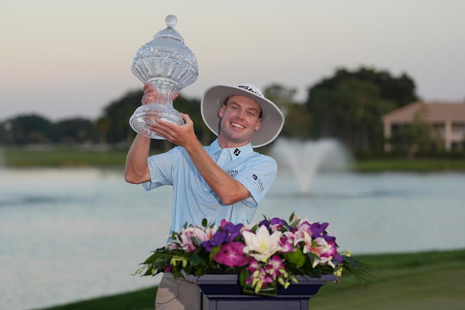Joe Highsmith lifts the crystal. (AP Photo/Rebecca Blackwell)