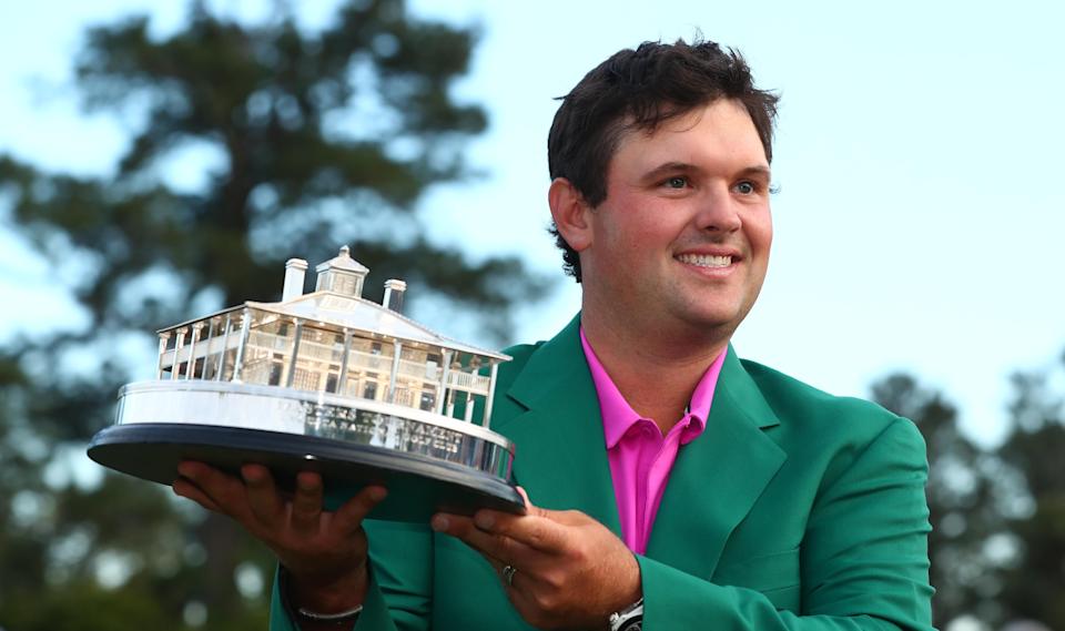 Patrick Reed holds up the trophy after winning the 2018 Masters Tournament at Augusta National Golf Club.