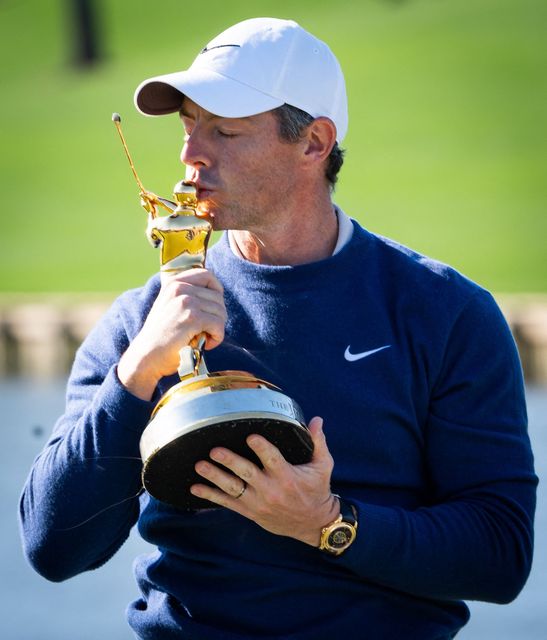 Rory McIlroy kisses the Players Championship Trophy after defeating JJ Spaun in a three-hole aggregate playoff. Photo: PA