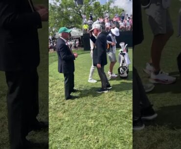 Tony Finau greeting tournament officials on the first hole at 2025 Arnold Palmer Invitational.