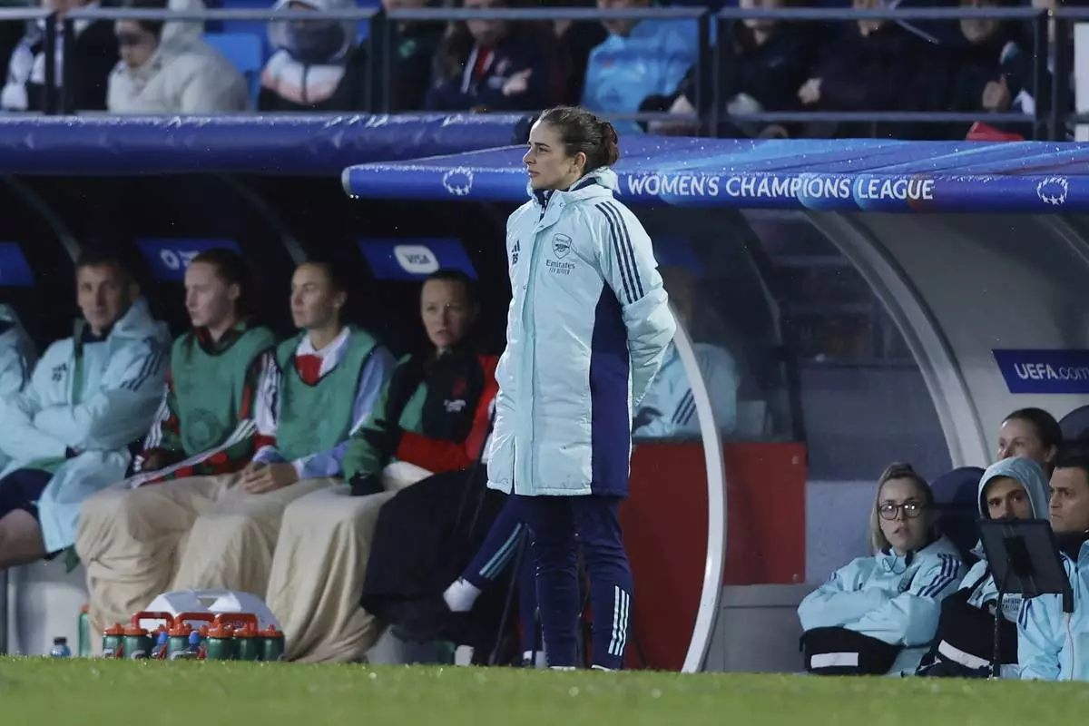 Arsenal's head coach Renee Slegers watches the play during the Women's Champions League quarterfinal first leg soccer match between Real Madrid and Arsenal at the Alfredo di Stefano stadium in Madrid, Spain, Tuesday March 18, 2025. (AP Photo/Fran Berg)