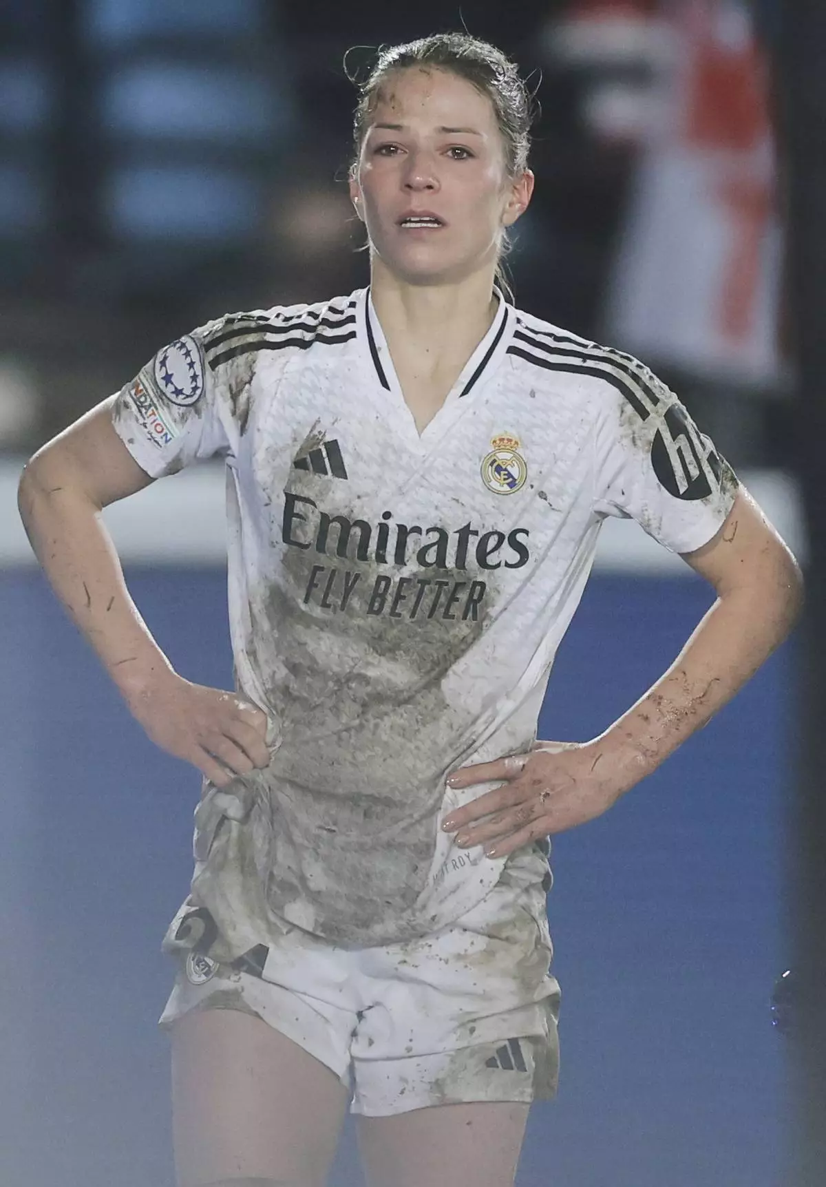 Real Madrid's Melanie Leupolz stands watching after coming off injured during the Women's Champions League quarterfinal first leg soccer match between Real Madrid and Arsenal at the Alfredo di Stefano stadium in Madrid, Spain, Tuesday March 18, 2025. (AP Photo/Fran Berg)