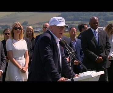 Protester greets Donald Trump at Scottish golf course