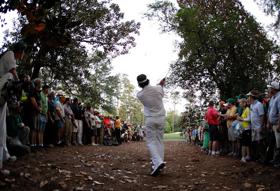 Bubba Watson of the United States plays at a shot from the rough on second sudden death playoff hole on the 10th during the final round of the 2012 Masters Tournament at Augusta National Golf Club on April 8, 2012 in Augusta, Georgia.