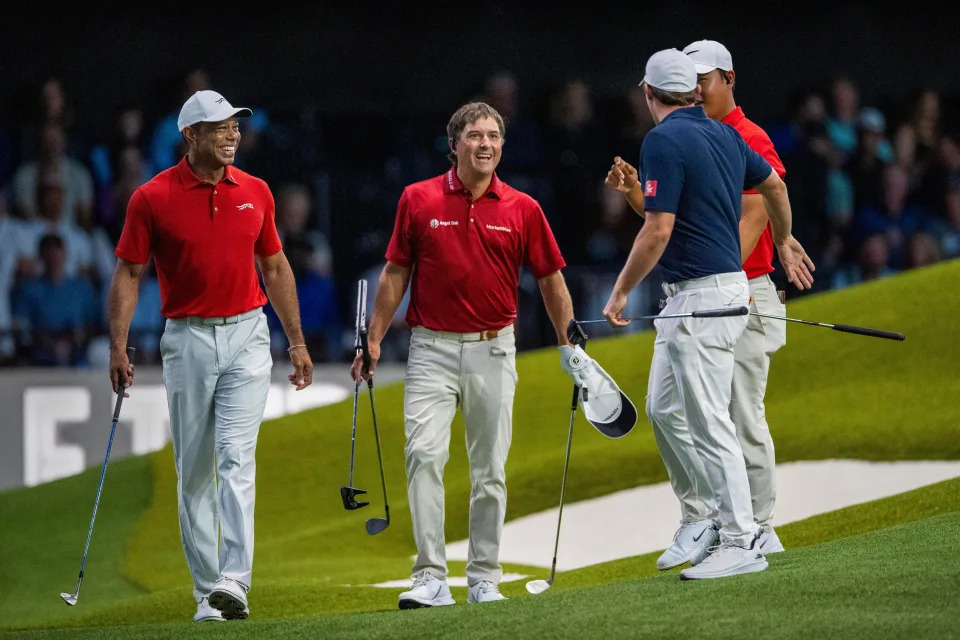 Kevin Kisner, center, laughs after just missing a putt next to Tiger Woods, left, of Jupiter Links GC and Matt Fitzpatrick of New York Golf Club during a TGL match in SoFi Center at Palm Beach State College on February 18, 2025, in Palm Beach Gardens, Florida.