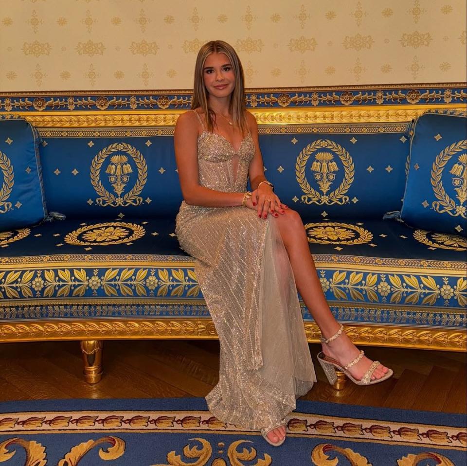 Kai Trump poses for pictures in her dress which was sent to her by Sherri Hill