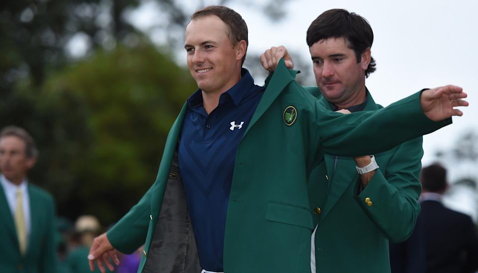 Masters defending champion Bubba Watson places the Green Jacket on 2015 Champion Jordan Spieth at the 79th Masters Tournament at Augusta National Golf Club on April 12, 2015, in Augusta, Georgia. Photo by TIMOTHY A. CLARY/AFP/Getty Images