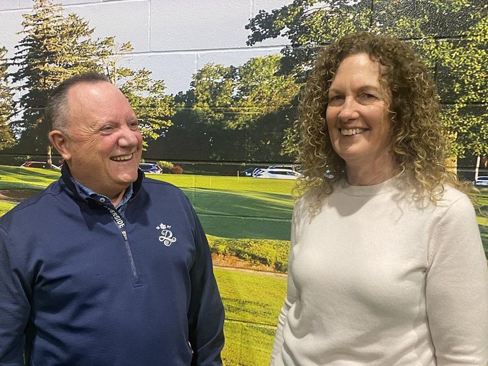  Jason Porter, Riverside Country Club’s general manager and executive professional, and Moira Gagnon, host club tournament chair, will be busy in the coming months preparing for the 2025 Canadian Women’s Amateur Championship in July. Riverside Country Club will be hosting the event for the second time in its 128-year history. The scenery behind the pair is courtesy of a sunny mural at the club.