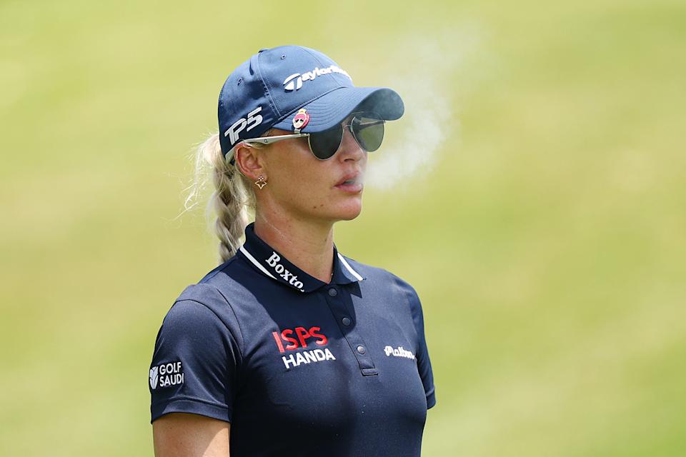 SINGAPORE, SINGAPORE - MARCH 01: Charley Hull of England smokes as she waits on the 18th hole during Day Three of the HSBC Women's World Championship 2025 at Sentosa Golf Club on March 01, 2025 in Singapore. (Photo by Yong Teck Lim/Getty Images)