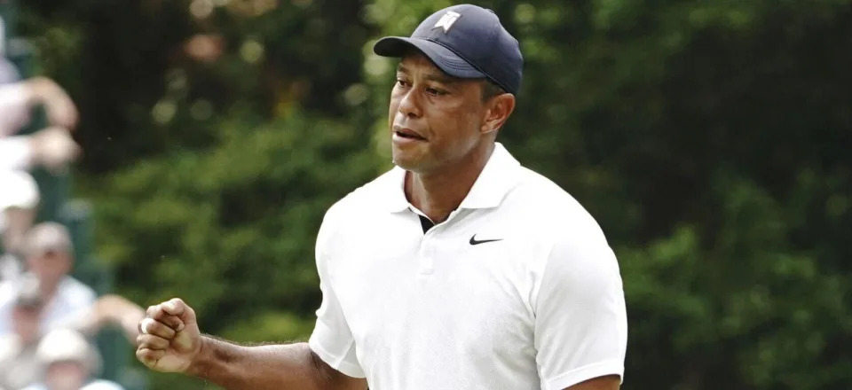 Tiger Woods reacts after making a birdie putt on the 15th hole during the first round of theMasters Tournament at Augusta National Golf Club