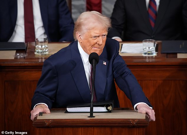 President Trump had to pause as shouting could be heard on the floor of Congress