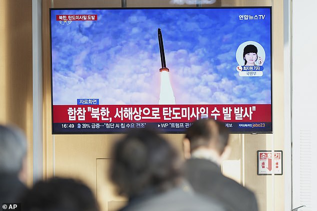 A TV screen shows a report of North Korea's missiles launch with file image during a news program at the Seoul Railway Statio