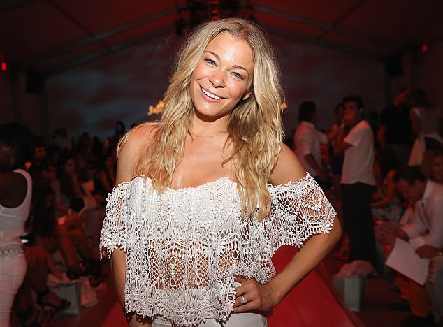 Woods enjoyed a brief romance with Can't Fight the Moonlight popstar LeAnn Rimes (pictured)