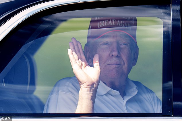 Trump wears a red Make America Great Again cap when he plays golf