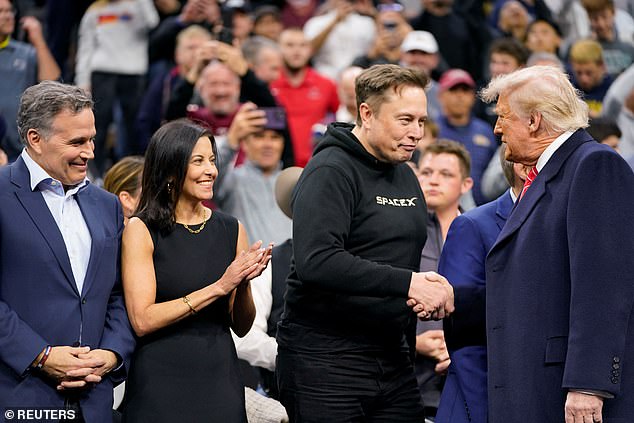 Trump shakes hands with Elon Musk and the rest of his entourage, who were sat by the mat