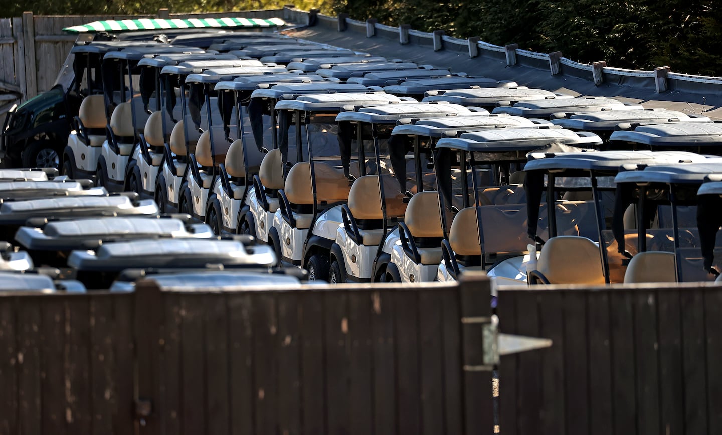 Golf carts are lined up and ready to go at Shining Rock Golf Club in Northbridge, Mass., on Tuesday.