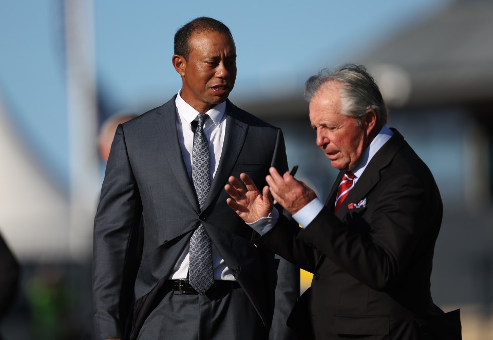 ST ANDREWS, SCOTLAND - JULY 12: Tiger Woods of the United States and Gary Player of South Africa talk before the Past Champions Dinner prior to The 150th Open at St Andrews Old Course on July 12, 2022 in St Andrews, Scotland. (Photo by Oisin Keniry/R&A/R&A via Getty Images)