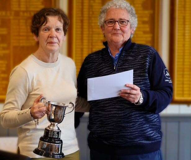 Julie Burman holding the Bury St Edmunds’ Juby Cup after a presentation from Ladies' captain Wendy Flack. Picture: Julie Byford