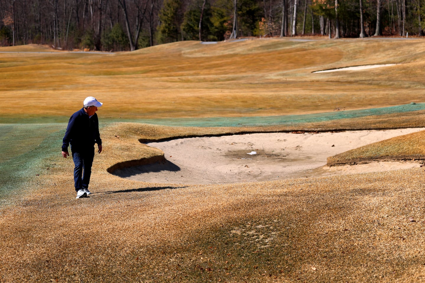 Lou Papadellis, general manager at Shining Rock Golf Club in Northbridge, Mass., checks the grounds on Tuesday. 
