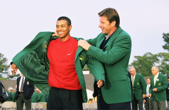 Tiger Woods Puts On The Green Jacket