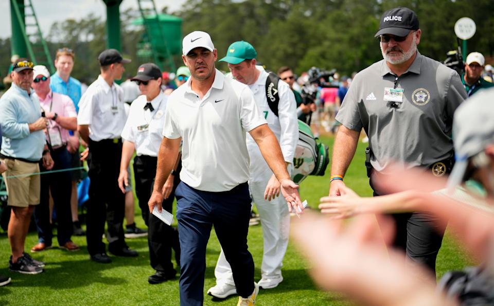 Brooks Koepka greets patrons after finishing his second round at the 2023 Masters. (Photo: Rob Schumacher-USA TODAY Network)