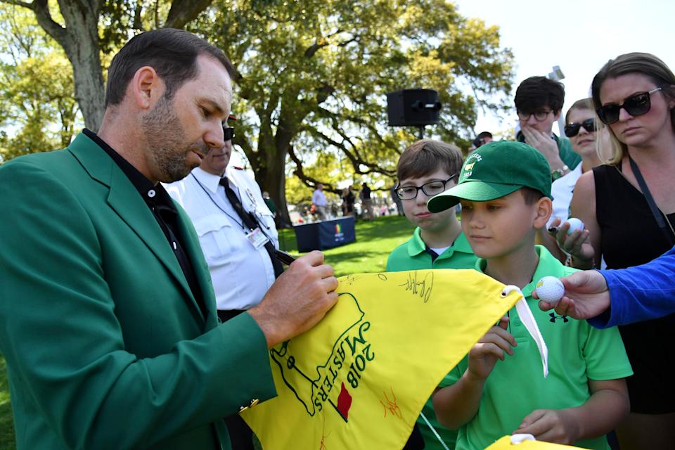Sergio Garcia, the 2017 Masters Champion, signs autographs during the finals of the 2018 Drive, Chip & Putt competition at Augusta National GC. Photo by Michael Madrid/USA TODAY Sports
