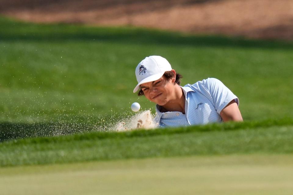 Mar 19, 2025; Graniteville, South Carolina, USA; Charlie Woods hits out of the bunker on No. 18 green during the first round of the Junior Invitational at Sage Valley Golf Club. Woods is the son of golf legend Tiger Woods and finished at +6. Mandatory Credit: Katie Goodale - Augusta Chronicle/USA TODAY NETWORK