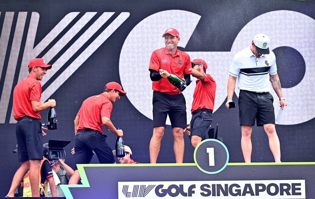 Fireballs captain Sergio Garcia sprays champagne over teammates Abraham Ancer, Luis Masaveu and David Puig. Photo: Reuters