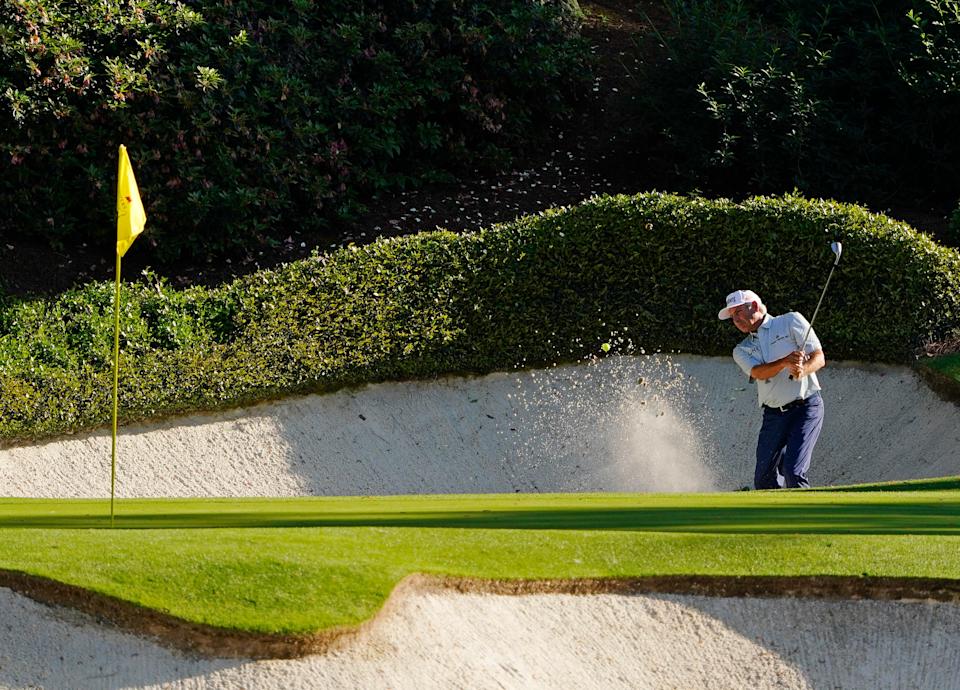 Fred Couples hits out of a bunker on No. 12 during the first round of the 2024 Masters Tournament. (Photo: Katie Goodale-USA TODAY Network)