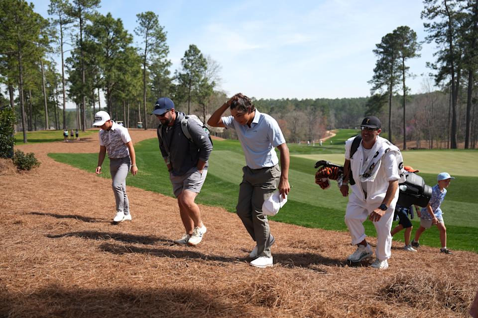 Mar 19, 2025; Graniteville, South Carolina, USA; Charlie Woods walks off No. 18 green after finishing the first round of the Junior Invitational at Sage Valley Golf Club. Woods is the son of golf legend Tiger Woods and finished at +6. Mandatory Credit: Katie Goodale - Augusta Chronicle/USA TODAY NETWORK