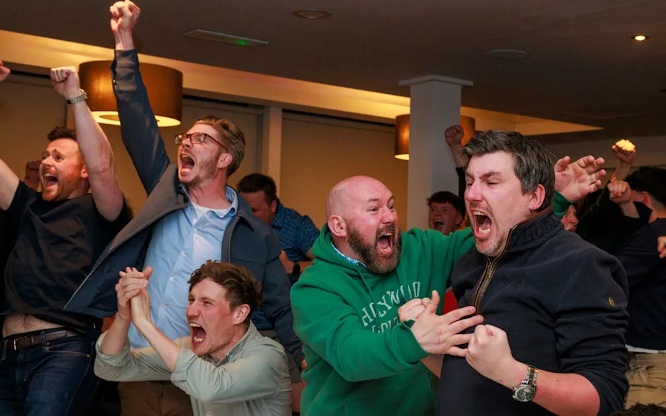 Members of Rory McIlroy's Holywood Golf Club in County Down, Belfast celebrate as he wins the US Masters 2025