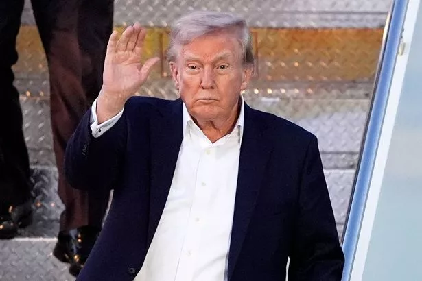 President Donald Trump arrives at Palm Beach International Airport, Friday, April 11, 2025, in West Palm Beach, Fla. (AP Photo/Manuel Balce Ceneta)