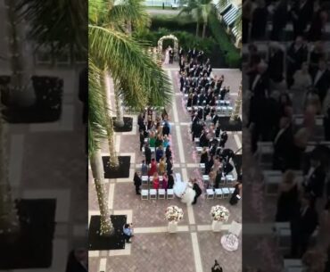 Wedding couple off to party at the Ritz Carlton Golf Resort in Naples, Florida on 12/3/22