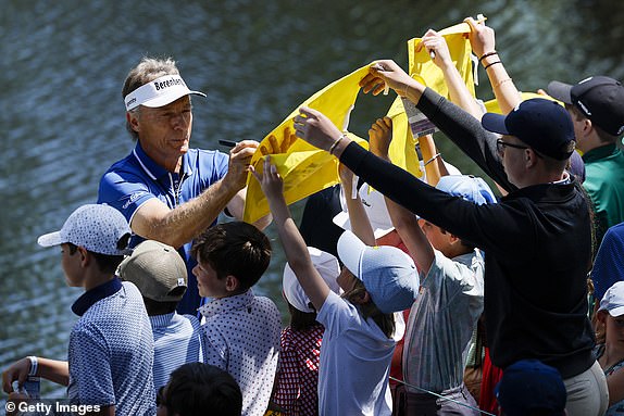 AUGUSTA, GEORGIA - APRIL 09: Bernhard Langer of Germany  signs autographs for patrons on the ninth hole during the Par Three Contest prior to the 2025 Masters Tournament at Augusta National Golf Club on April 09, 2025 in Augusta, Georgia. (Photo by Harry How/Getty Images)