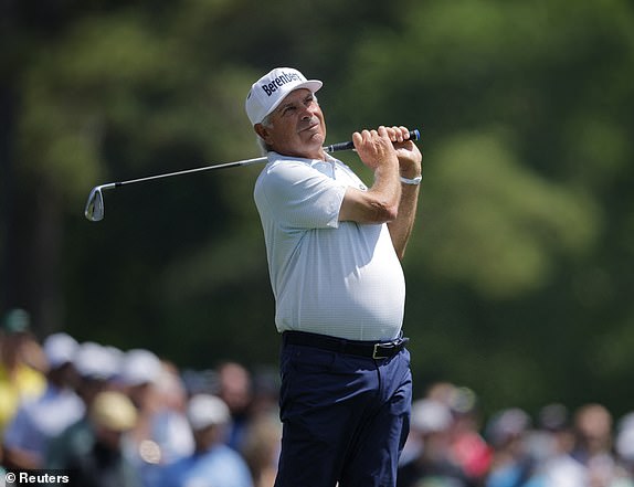 Golf - The Masters - Augusta National Golf Club, Augusta, Georgia, U.S. - April 10, 2025 Fred Couples of the U.S. watches his tee shot on the 12th hole during the first round REUTERS/Mike Blake