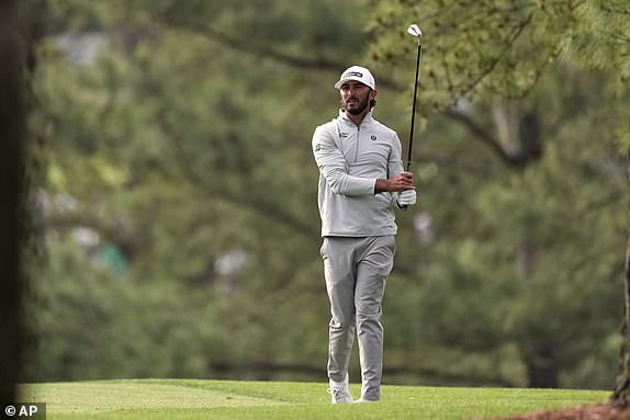 Max Homa hits from the rough on the first hole during the second round at the Masters golf tournament, Friday, April 11, 2025, in Augusta, Ga. (AP Photo/Matt Slocum)