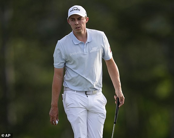 Matt Fitzpatrick, of England, walks off the green on the 18th hole during the first round at the Masters golf tournament, Thursday, April 10, 2025, in Augusta, Ga. (AP Photo/George Walker IV)