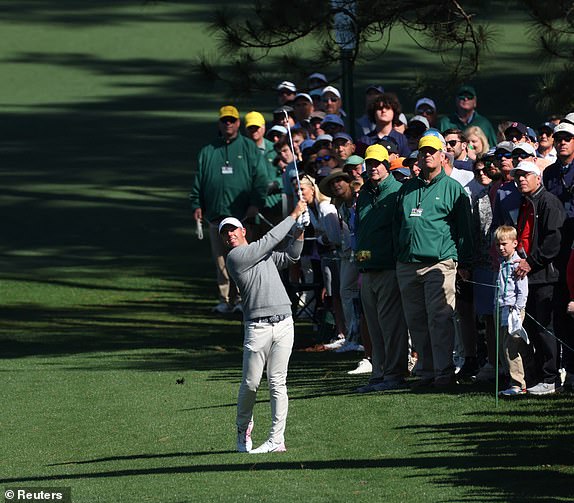 Golf - The Masters - Augusta National Golf Club, Augusta, Georgia, U.S. - April 11, 2025 Northern Ireland's Rory McIlroy hits his approach on the 2nd hole during the second round REUTERS/Mike Segar