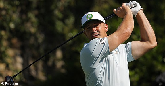 Golf - The Masters - Augusta National Golf Club, Augusta, Georgia, U.S. - April 11, 2025 Bryson DeChambeau of the U.S. hits his tee shot on the 2nd hole during the second round REUTERS/Mike Blake
